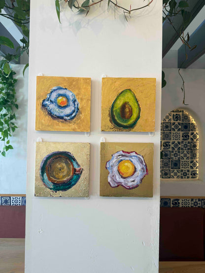 Four Gold Series original oil paintings by Kritteka displayed on a white gallery wall